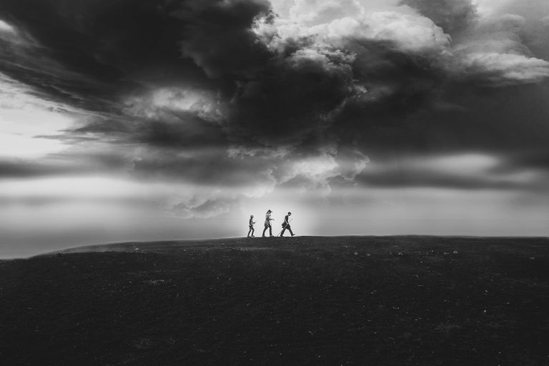 Three children clouds hiking a mountain